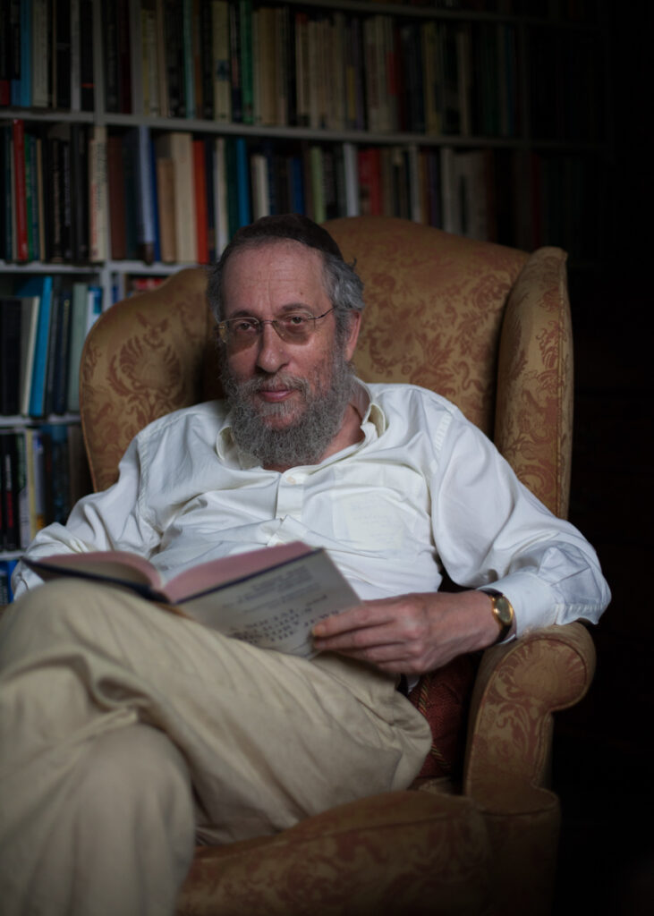 Portrait from the “21 Jewish Krakowians” series documenting contemporary Jewish life in Krakow. Jonathan Webber in his library reading a book.